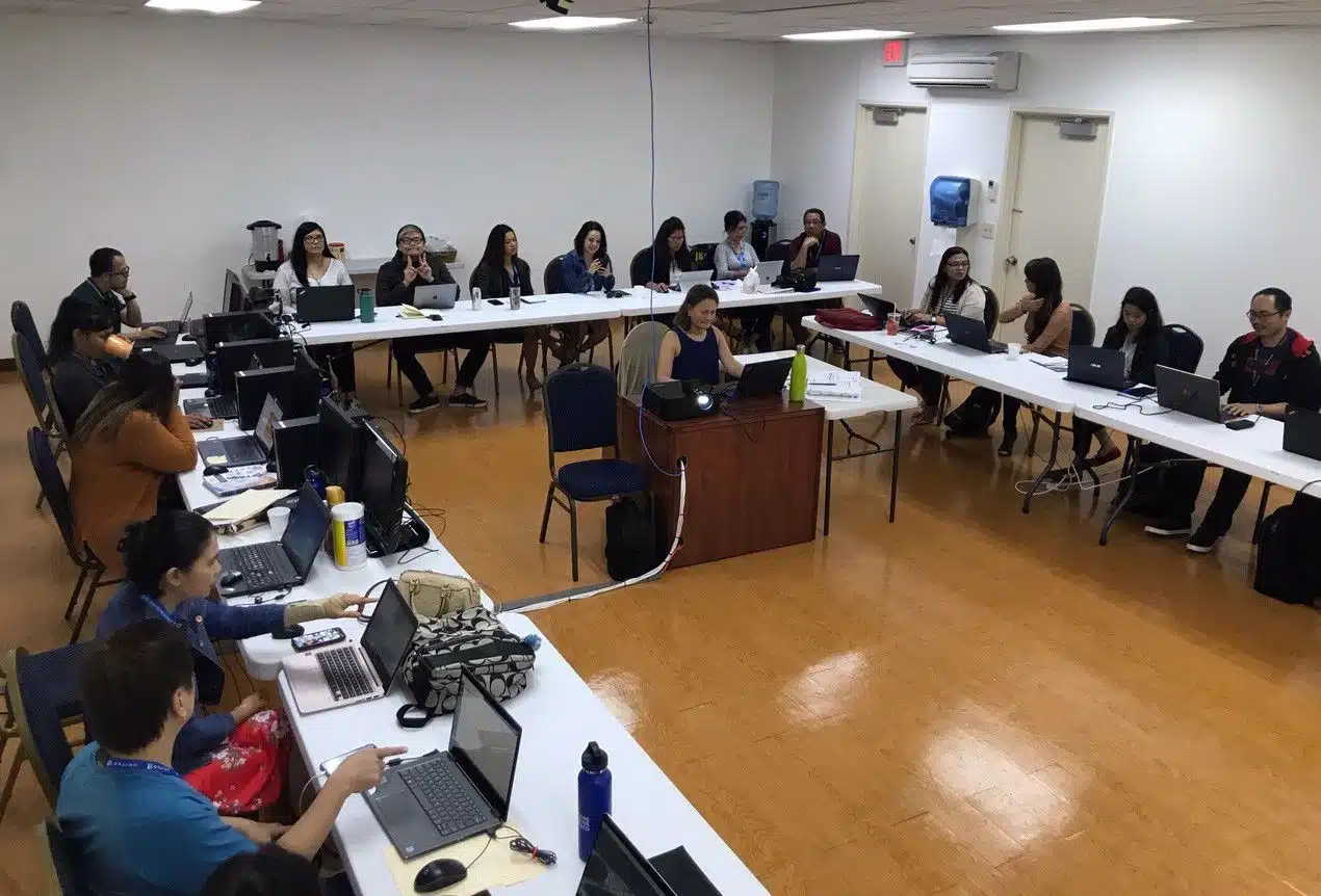 IDI-University-offers-a-wide-variety-of-training-modules-to-help-you-get-the-most-from-CostGuard_2625_40189761_0_14145946_1270 Training meeting - horseshoe pattern of tables and the teacher in the center