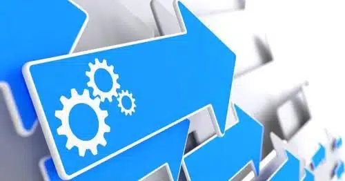 stock imagery of blue arrows pointing to the right and the main arrow has cog wheel icon in it