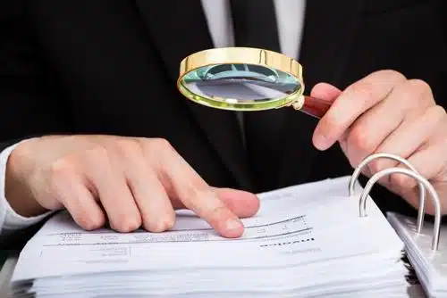 man using magnifying glass